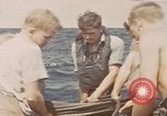 Image of Submarine, USS Cod, rescuing crew of Dutch submarine, O-19 Spratly Islands, 1945, second 5 stock footage video 65675076085