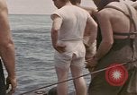 Image of Submarine, USS Cod, rescuing crew of Dutch submarine, O-19 Spratly Islands, 1945, second 20 stock footage video 65675076085