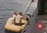Image of Submarine, USS Cod, rescuing crew of Dutch submarine, O-19 Spratly Islands, 1945, second 21 stock footage video 65675076085