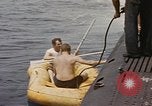 Image of Submarine, USS Cod, rescuing crew of Dutch submarine, O-19 Spratly Islands, 1945, second 23 stock footage video 65675076085