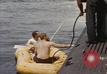 Image of Submarine, USS Cod, rescuing crew of Dutch submarine, O-19 Spratly Islands, 1945, second 25 stock footage video 65675076085