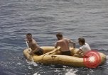 Image of Submarine, USS Cod, rescuing crew of Dutch submarine, O-19 Spratly Islands, 1945, second 30 stock footage video 65675076085
