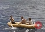 Image of Submarine, USS Cod, rescuing crew of Dutch submarine, O-19 Spratly Islands, 1945, second 32 stock footage video 65675076085