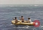Image of Submarine, USS Cod, rescuing crew of Dutch submarine, O-19 Spratly Islands, 1945, second 36 stock footage video 65675076085