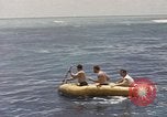 Image of Submarine, USS Cod, rescuing crew of Dutch submarine, O-19 Spratly Islands, 1945, second 38 stock footage video 65675076085