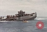 Image of Submarine, USS Cod, rescuing crew of Dutch submarine, O-19 Spratly Islands, 1945, second 52 stock footage video 65675076085