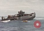 Image of Submarine, USS Cod, rescuing crew of Dutch submarine, O-19 Spratly Islands, 1945, second 53 stock footage video 65675076085