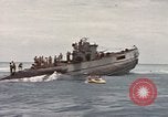Image of Submarine, USS Cod, rescuing crew of Dutch submarine, O-19 Spratly Islands, 1945, second 54 stock footage video 65675076085