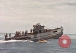 Image of Submarine, USS Cod, rescuing crew of Dutch submarine, O-19 Spratly Islands, 1945, second 56 stock footage video 65675076085