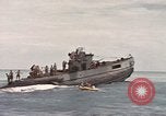 Image of Submarine, USS Cod, rescuing crew of Dutch submarine, O-19 Spratly Islands, 1945, second 57 stock footage video 65675076085