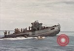 Image of Submarine, USS Cod, rescuing crew of Dutch submarine, O-19 Spratly Islands, 1945, second 58 stock footage video 65675076085