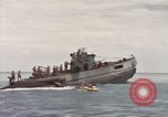 Image of Submarine, USS Cod, rescuing crew of Dutch submarine, O-19 Spratly Islands, 1945, second 59 stock footage video 65675076085
