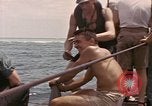 Image of Submarine, USS Cod, rescuing crew of Dutch submarine, O-19 Spratly Islands, 1945, second 62 stock footage video 65675076085