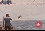 Image of USS Cod (SS-224) rescuing crew from Dutch submarine (O-19) Spratly Islands, 1945, second 1 stock footage video 65675076087