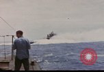 Image of USS Cod (SS-224) rescuing crew from Dutch submarine (O-19) Spratly Islands, 1945, second 3 stock footage video 65675076087