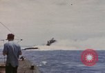 Image of USS Cod (SS-224) rescuing crew from Dutch submarine (O-19) Spratly Islands, 1945, second 5 stock footage video 65675076087