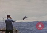 Image of USS Cod (SS-224) rescuing crew from Dutch submarine (O-19) Spratly Islands, 1945, second 7 stock footage video 65675076087