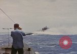 Image of USS Cod (SS-224) rescuing crew from Dutch submarine (O-19) Spratly Islands, 1945, second 14 stock footage video 65675076087