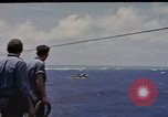 Image of USS Cod (SS-224) rescuing crew from Dutch submarine (O-19) Spratly Islands, 1945, second 15 stock footage video 65675076087