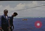 Image of USS Cod (SS-224) rescuing crew from Dutch submarine (O-19) Spratly Islands, 1945, second 17 stock footage video 65675076087