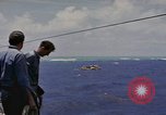 Image of USS Cod (SS-224) rescuing crew from Dutch submarine (O-19) Spratly Islands, 1945, second 18 stock footage video 65675076087