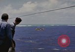 Image of USS Cod (SS-224) rescuing crew from Dutch submarine (O-19) Spratly Islands, 1945, second 19 stock footage video 65675076087