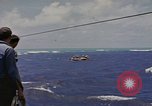 Image of USS Cod (SS-224) rescuing crew from Dutch submarine (O-19) Spratly Islands, 1945, second 20 stock footage video 65675076087