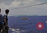 Image of USS Cod (SS-224) rescuing crew from Dutch submarine (O-19) Spratly Islands, 1945, second 21 stock footage video 65675076087