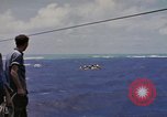 Image of USS Cod (SS-224) rescuing crew from Dutch submarine (O-19) Spratly Islands, 1945, second 22 stock footage video 65675076087