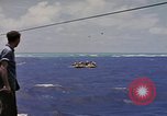 Image of USS Cod (SS-224) rescuing crew from Dutch submarine (O-19) Spratly Islands, 1945, second 23 stock footage video 65675076087