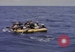 Image of USS Cod (SS-224) rescuing crew from Dutch submarine (O-19) Spratly Islands, 1945, second 24 stock footage video 65675076087