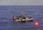 Image of USS Cod (SS-224) rescuing crew from Dutch submarine (O-19) Spratly Islands, 1945, second 25 stock footage video 65675076087