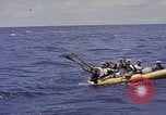 Image of USS Cod (SS-224) rescuing crew from Dutch submarine (O-19) Spratly Islands, 1945, second 26 stock footage video 65675076087