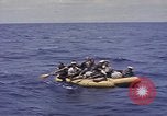 Image of USS Cod (SS-224) rescuing crew from Dutch submarine (O-19) Spratly Islands, 1945, second 27 stock footage video 65675076087