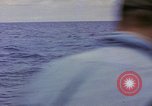 Image of USS Cod (SS-224) rescuing crew from Dutch submarine (O-19) Spratly Islands, 1945, second 28 stock footage video 65675076087