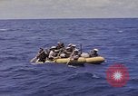 Image of USS Cod (SS-224) rescuing crew from Dutch submarine (O-19) Spratly Islands, 1945, second 30 stock footage video 65675076087