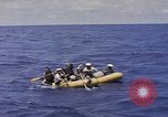 Image of USS Cod (SS-224) rescuing crew from Dutch submarine (O-19) Spratly Islands, 1945, second 31 stock footage video 65675076087