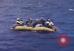 Image of USS Cod (SS-224) rescuing crew from Dutch submarine (O-19) Spratly Islands, 1945, second 32 stock footage video 65675076087