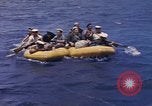 Image of USS Cod (SS-224) rescuing crew from Dutch submarine (O-19) Spratly Islands, 1945, second 34 stock footage video 65675076087