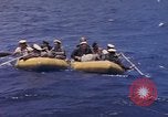 Image of USS Cod (SS-224) rescuing crew from Dutch submarine (O-19) Spratly Islands, 1945, second 35 stock footage video 65675076087