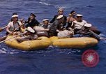 Image of USS Cod (SS-224) rescuing crew from Dutch submarine (O-19) Spratly Islands, 1945, second 36 stock footage video 65675076087