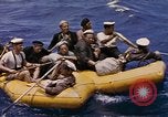 Image of USS Cod (SS-224) rescuing crew from Dutch submarine (O-19) Spratly Islands, 1945, second 41 stock footage video 65675076087