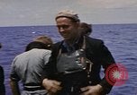 Image of USS Cod (SS-224) rescuing crew from Dutch submarine (O-19) Spratly Islands, 1945, second 44 stock footage video 65675076087