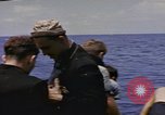 Image of USS Cod (SS-224) rescuing crew from Dutch submarine (O-19) Spratly Islands, 1945, second 45 stock footage video 65675076087