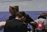 Image of USS Cod (SS-224) rescuing crew from Dutch submarine (O-19) Spratly Islands, 1945, second 46 stock footage video 65675076087