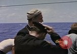 Image of USS Cod (SS-224) rescuing crew from Dutch submarine (O-19) Spratly Islands, 1945, second 47 stock footage video 65675076087
