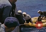Image of USS Cod (SS-224) rescuing crew from Dutch submarine (O-19) Spratly Islands, 1945, second 57 stock footage video 65675076087