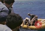 Image of USS Cod (SS-224) rescuing crew from Dutch submarine (O-19) Spratly Islands, 1945, second 60 stock footage video 65675076087