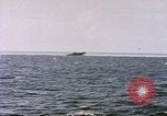 Image of USS Cod (SS-224) fires at Dutch submarine, O-19, to scuttle her Spratly Islands, 1945, second 3 stock footage video 65675076089