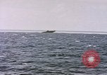 Image of USS Cod (SS-224) fires at Dutch submarine, O-19, to scuttle her Spratly Islands, 1945, second 4 stock footage video 65675076089